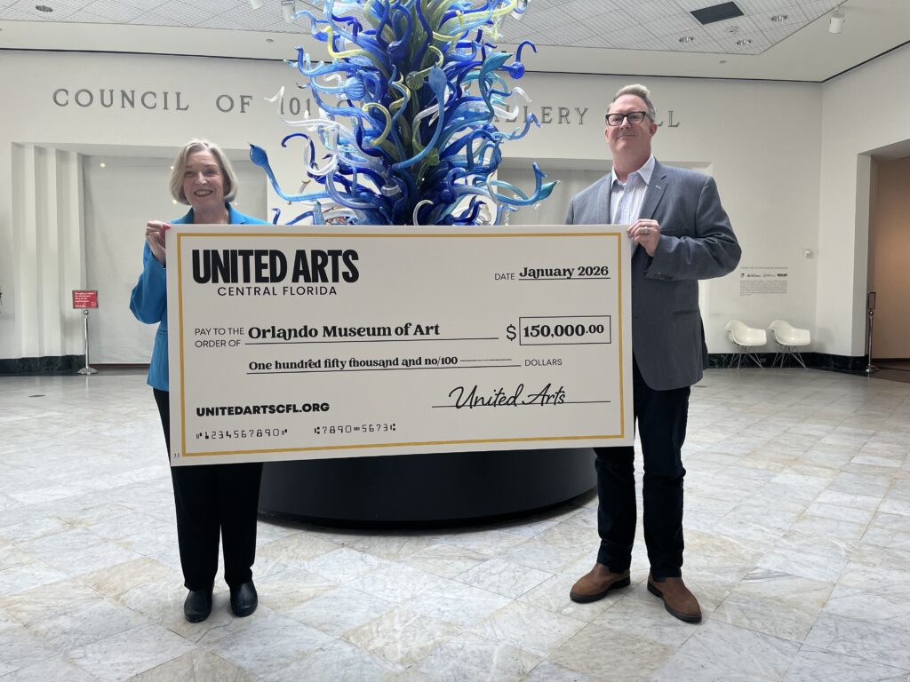 OMA Executive Director and CEO Cathryn Mattson receives a General operating Support check from John Ruffier, United Arts Board and Executive Committee Member